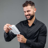 Thumbnail for Man Brown Photo Bracelet gift being unwrapped by a smiling man in a black shirt, showcasing thoughtful design by Brother & Sisters.