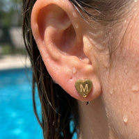 Thumbnail for Heart Initial Stud Earrings in Gold worn in a swimming pool, waterproof 304L stainless steel | SKU: heart-initial-gold-a