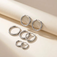 Thumbnail for Huggie Hoop Earrings Set of 4 Pairs in Silver, studio packshot of the pair on a plain background | SKU: huggie-set-silver