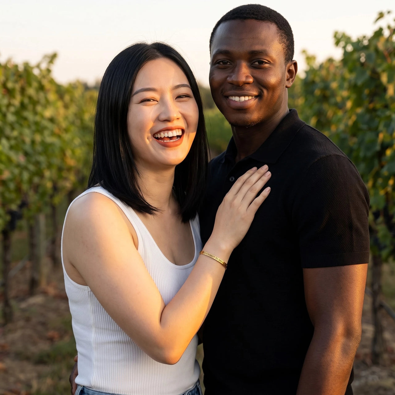 Couple moment, she wears the Never Forget To Dream bracelet in gold | SKU: nftd-g