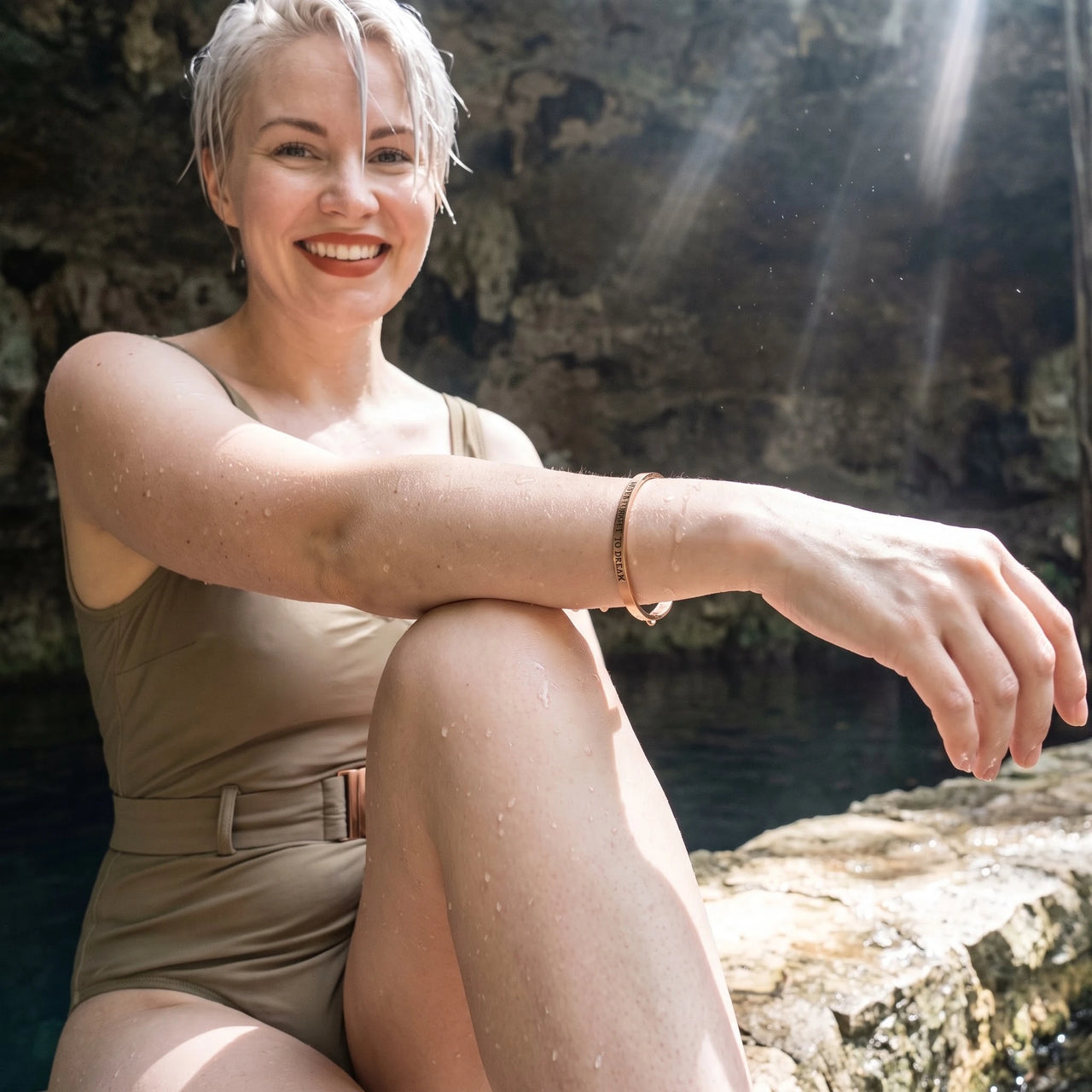 Never Forget To Dream bracelet in rose gold worn by the water | SKU: nftd-rg
