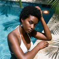 Thumbnail for Sculpted Crescent Drops in Silver, worn by a tropical pool | SKU: 41008-silver