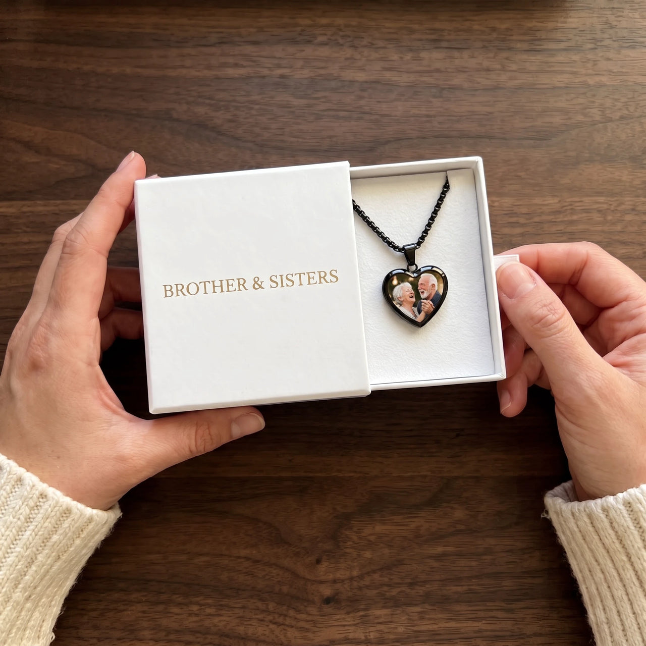 The black heart photo necklace with an anniversary photo in the Brother & Sisters gift box | SKU: TPH-CHTN-BLACK-SMALL