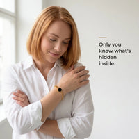 Thumbnail for Woman wearing the gold bracelet with its black round charm, only she knows the photo inside | SKU: TPH-RNDB-GOLD