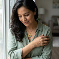 Thumbnail for Woman wearing the gold round photo necklace with her father's photo | SKU: TPH-RNDN-GOLD